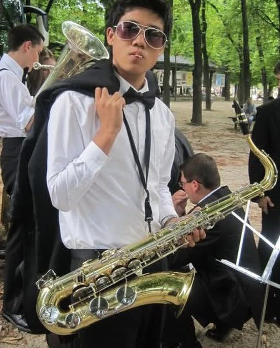 Playing saxophone in a wind ensemble